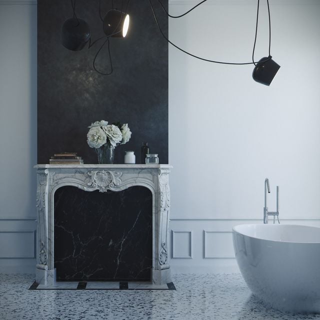 Ce Marmorino pourtant noir arbore d'élégants reflets brillants dans cette salle de bain moderne. Son rendu mat contraste avec le brillant des surfaces blanches.
